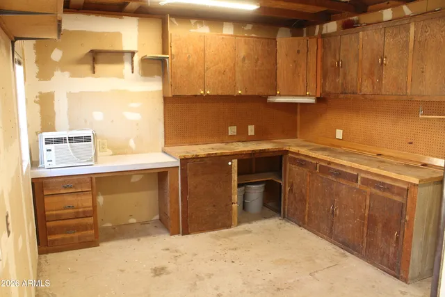 a kitchen with stainless steel appliances granite countertop a sink a stove and a microwave