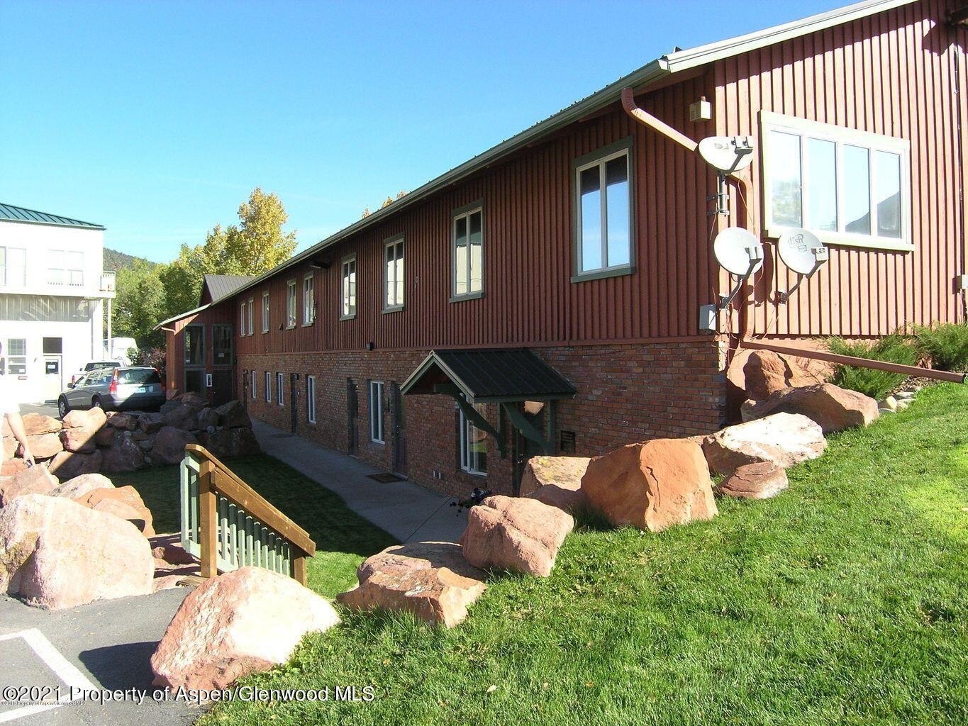 1101 Village Road, Unit LL3B Carbondale, CO 81623 - Photo 2 of 17 a front view of a house with a yard