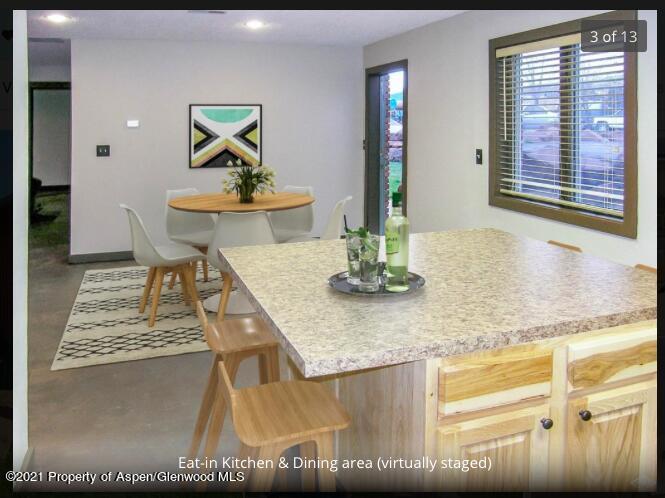 1101 Village Road, Unit LL3B Carbondale, CO 81623 - Photo 3 of 17 a kitchen with a table and cabinets