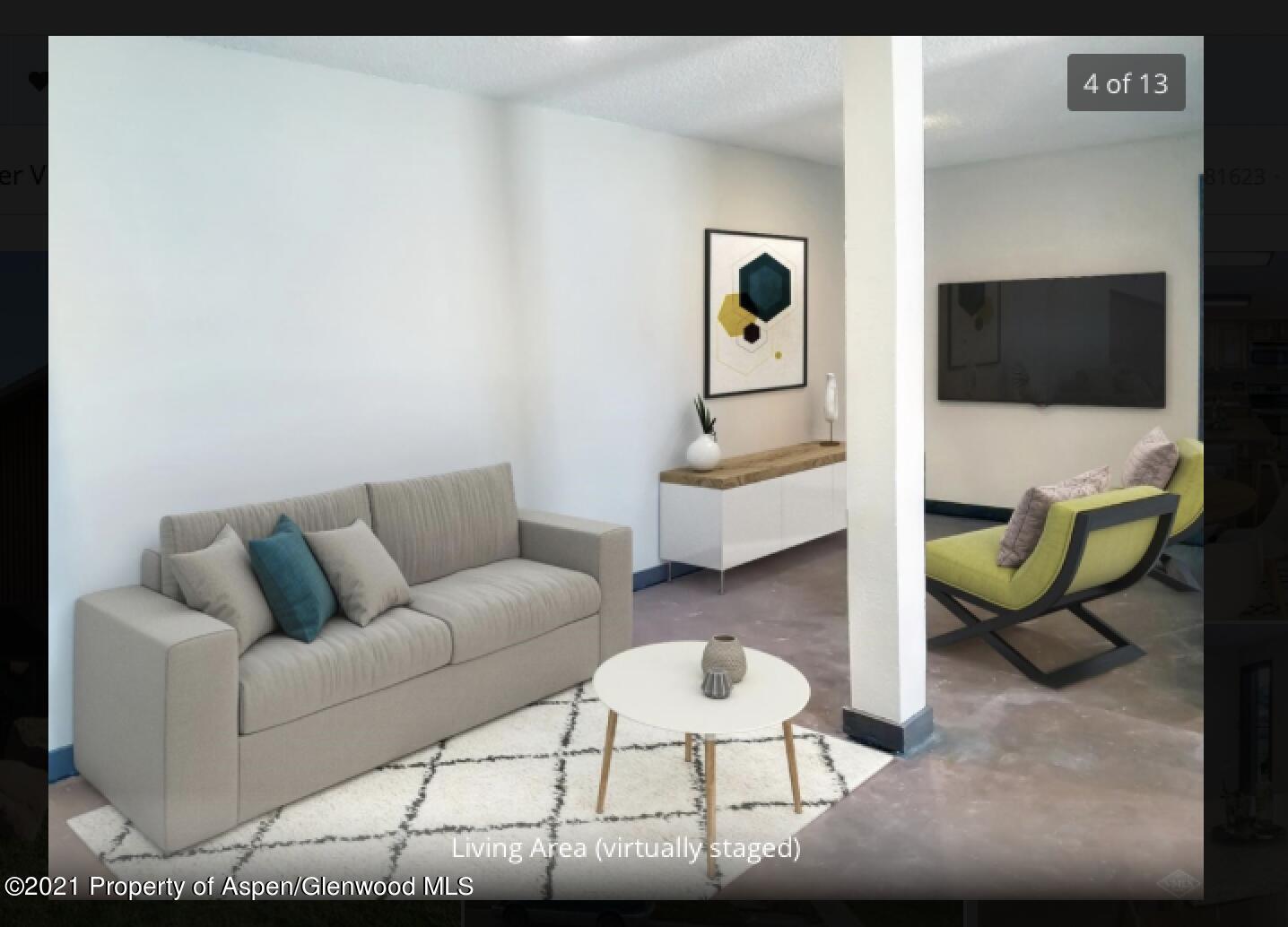 1101 Village Road, Unit LL3B Carbondale, CO 81623 - Photo 6 of 17 a living room with furniture and a flat screen tv