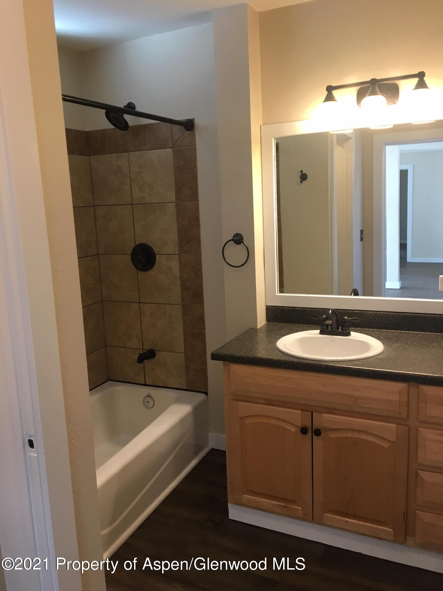 1101 Village Road, Unit LL3B Carbondale, CO 81623 - Photo 10 of 17 a bathroom with a tub a sink and mirror