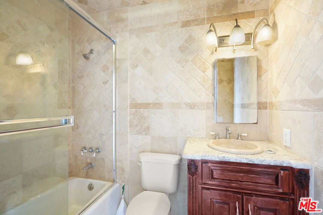 148 Van Nuys Avenue Oxnard, CA 93035 - Photo 28 of 37 a bathroom with a sink a toilet and shower