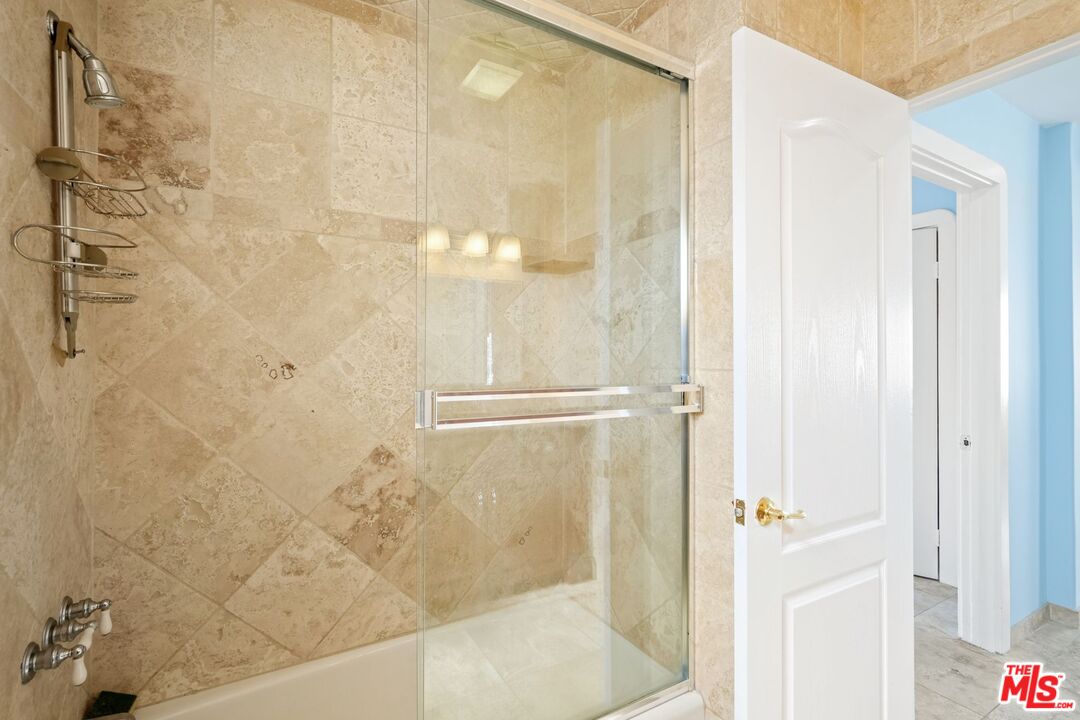 148 Van Nuys Avenue Oxnard, CA 93035 - Photo 29 of 37 a bathroom with a glass shower door