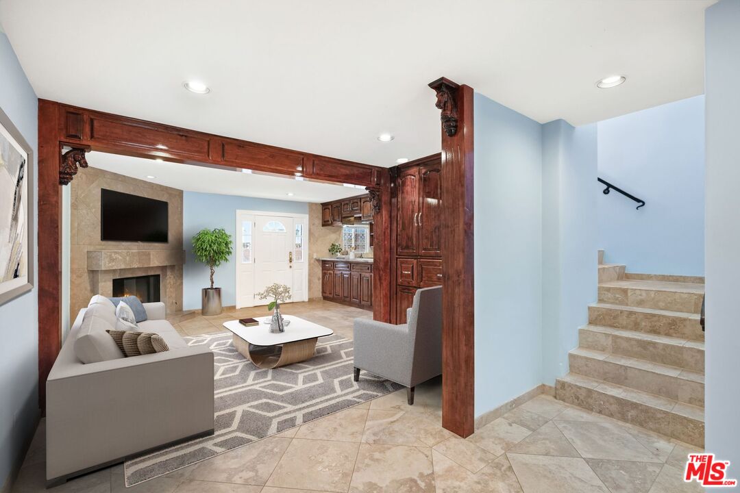 148 Van Nuys Avenue Oxnard, CA 93035 - Photo 3 of 37 a living room with furniture and a fireplace