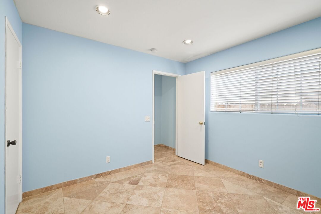 148 Van Nuys Avenue Oxnard, CA 93035 - Photo 10 of 37 a view of an empty room with a window