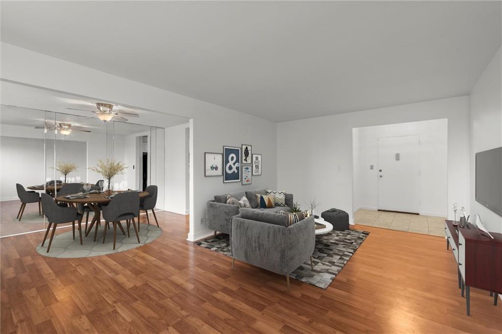 215 Piedmont Avenue Northeast, Unit 1608 Atlanta, GA 30308 - Photo 6 of 25 a living room with furniture and a wooden floor