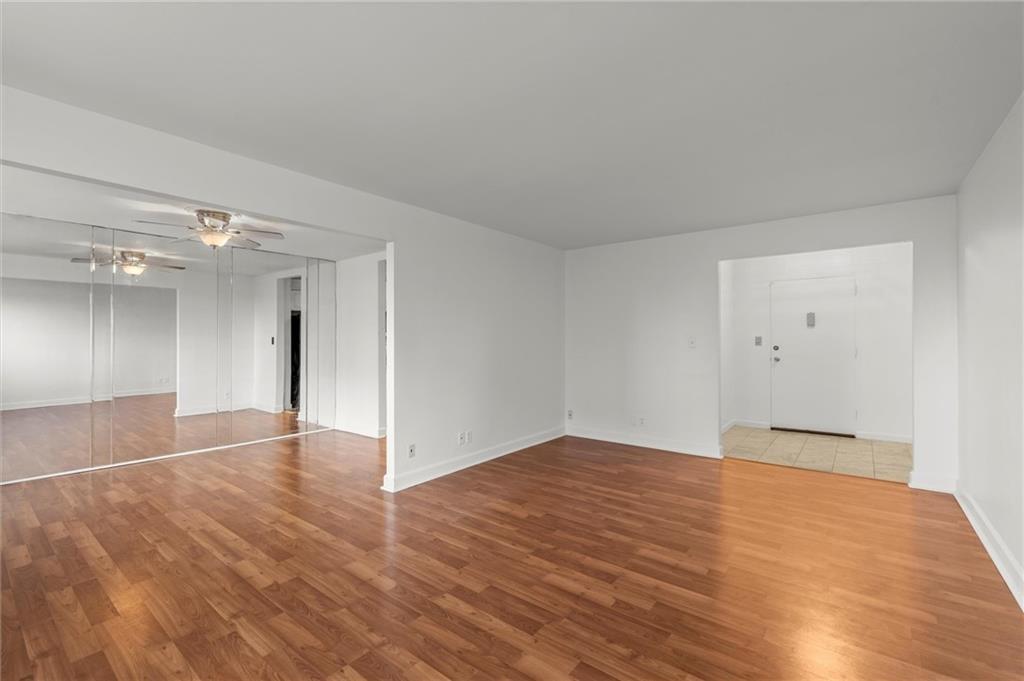 215 Piedmont Avenue Northeast, Unit 1608 Atlanta, GA 30308 - Photo 10 of 25 a view of an empty room and wooden floor
