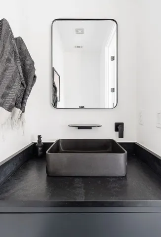 a bedroom with a large bed and a large window