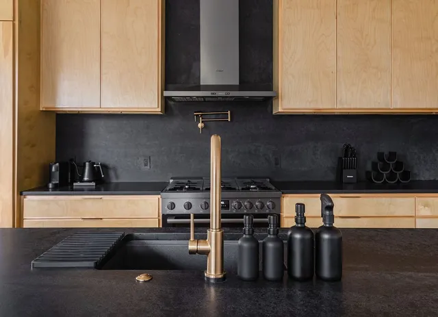 a view of a brick house with many windows