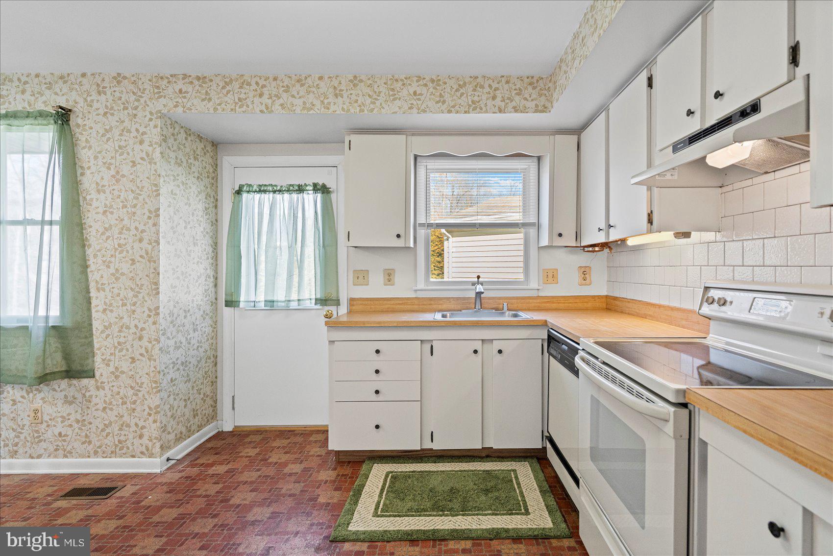 4006 Silvage Road Baltimore, MD 21236 - Photo 13 of 44 a kitchen with sink cabinets and window