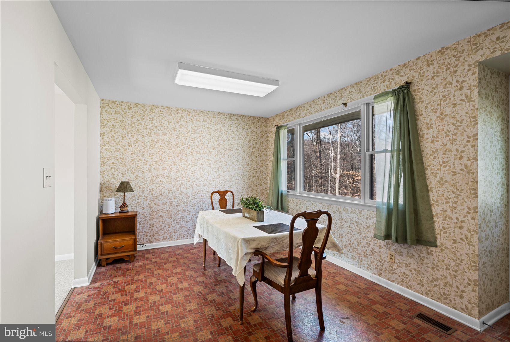 4006 Silvage Road Baltimore, MD 21236 - Photo 15 of 44 a dining room with furniture and a window