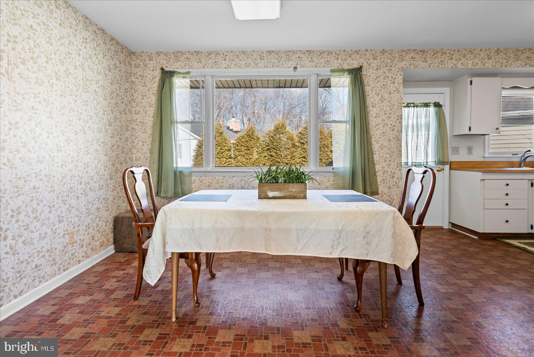 4006 Silvage Road Baltimore, MD 21236 - Photo 17 of 44 a view of a dining room with furniture window and outside view