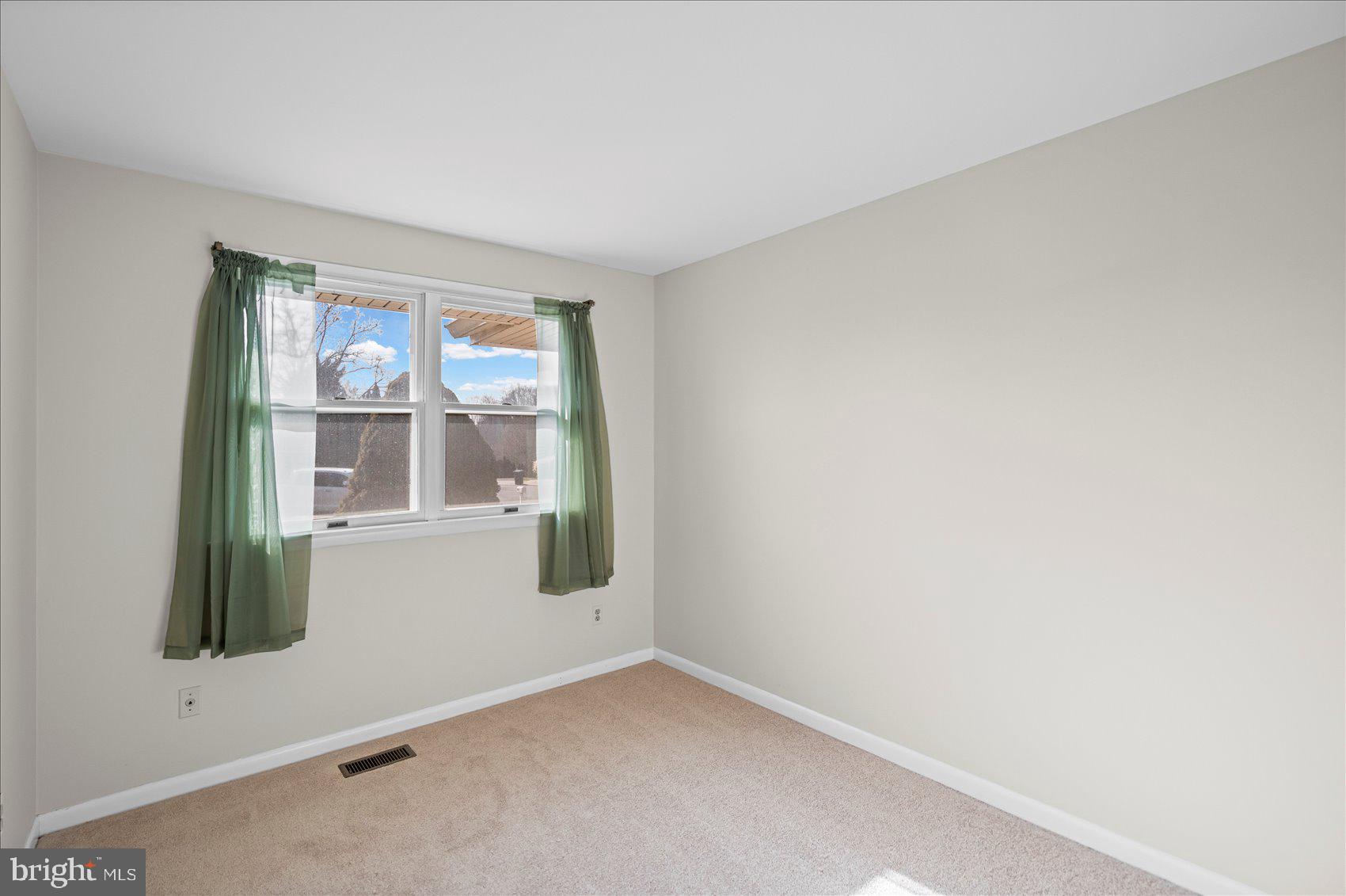 4006 Silvage Road Baltimore, MD 21236 - Photo 19 of 44 an empty room with windows