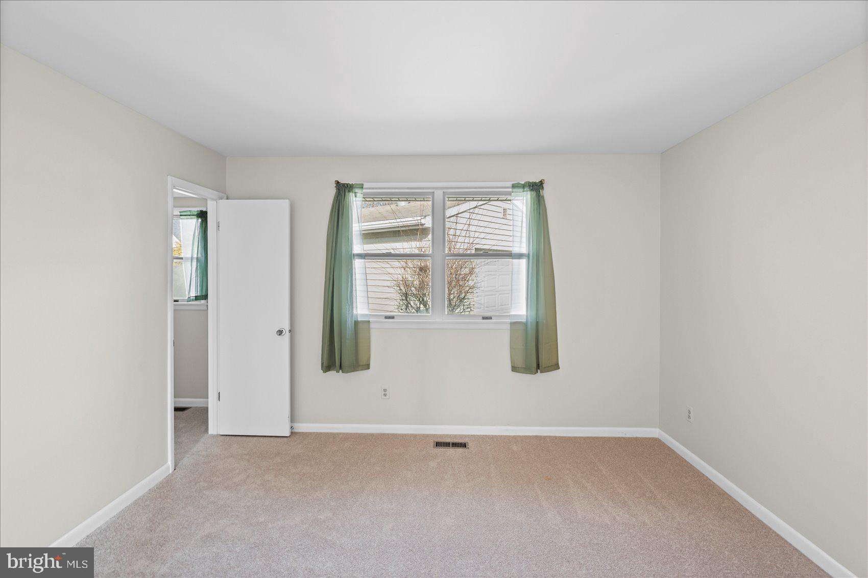 4006 Silvage Road Baltimore, MD 21236 - Photo 25 of 44 an empty room with windows