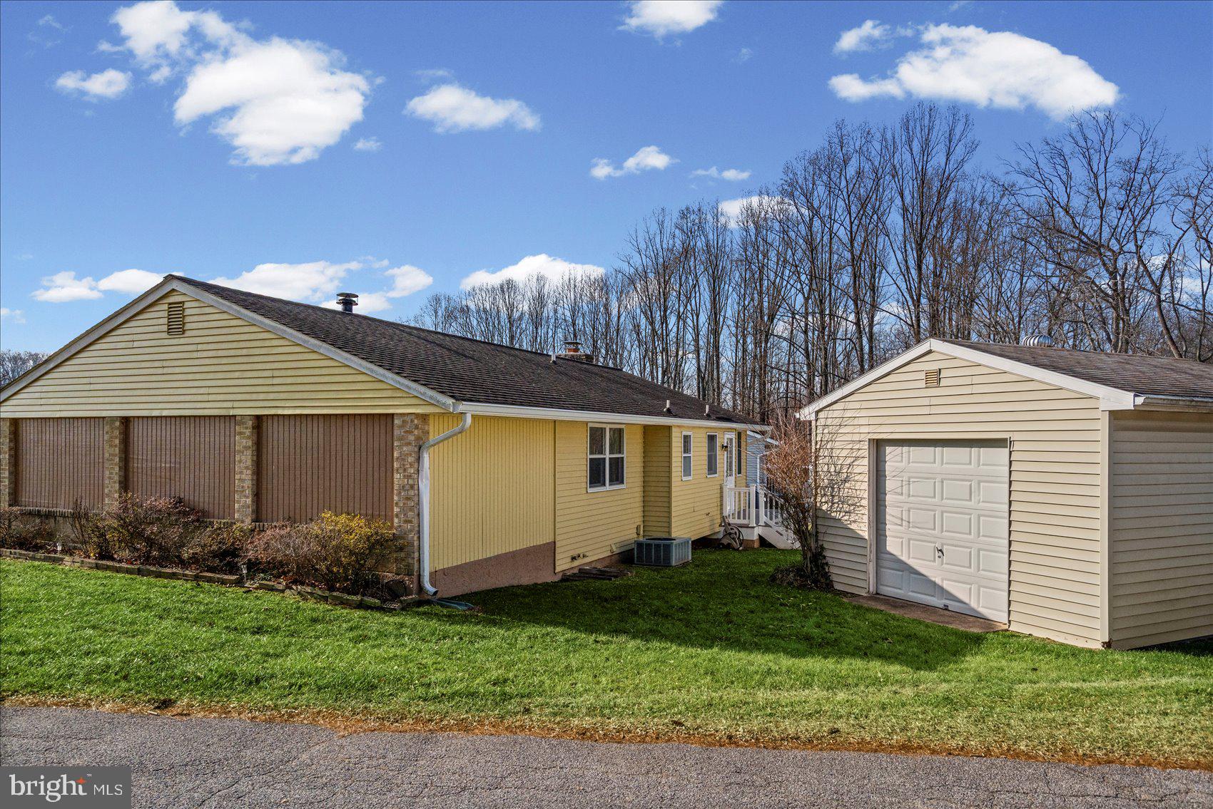4006 Silvage Road Baltimore, MD 21236 - Photo 40 of 44 a front view of a house with garden