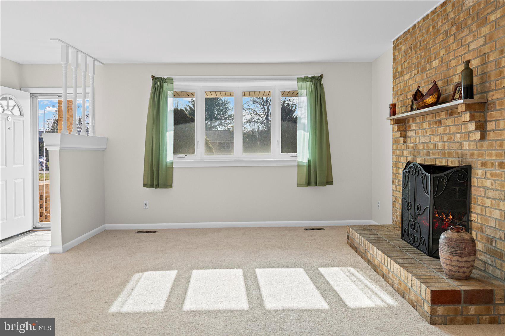 4006 Silvage Road Baltimore, MD 21236 - Photo 8 of 44 a view of livingroom with furniture and a fireplace