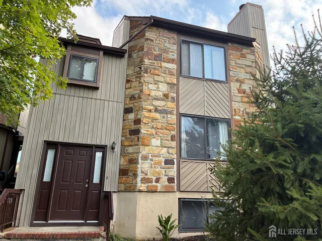 a front view of a house with garage