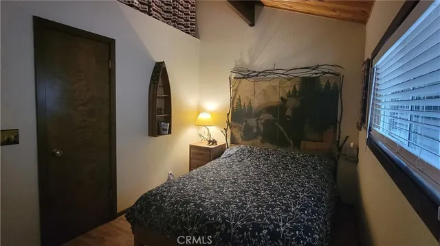 a bathroom with a granite countertop shower a mirror and a sink