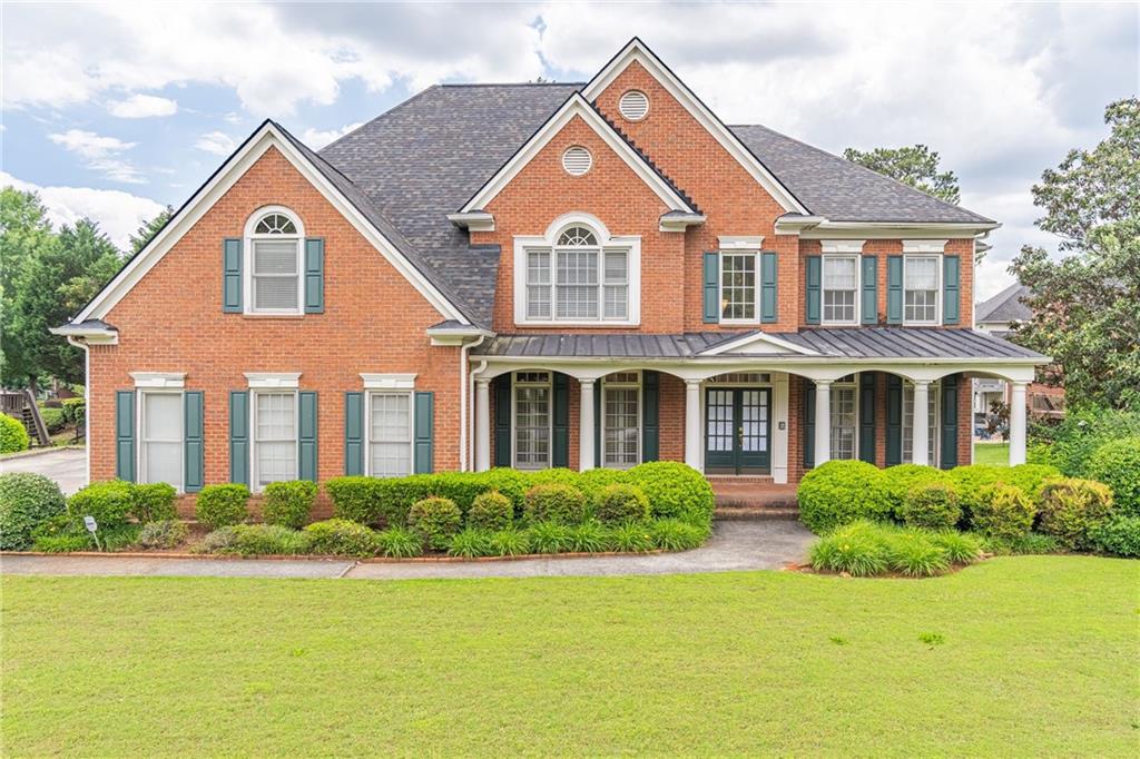 1900 Briergate Drive Duluth, GA 30097 - Photo 1 of 1 a front view of a house with garden
