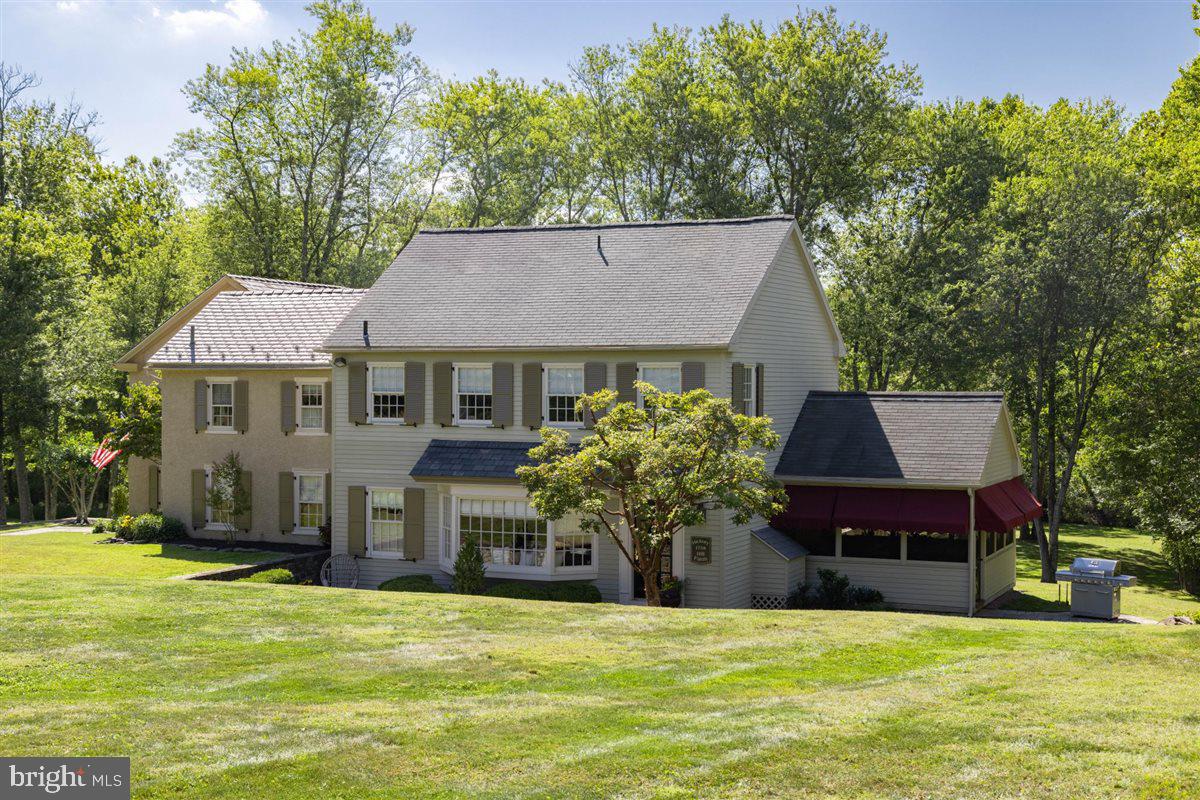 144 Creek Road Chalfont, PA 18914 - Photo 4 of 48 Cedar sided addition with screened porch
