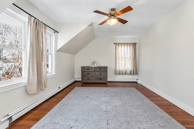 a view of room with a ceiling fan and window