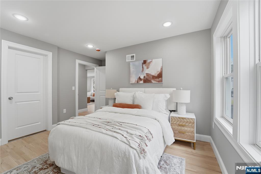 64 Morningside Road Verona, NJ 07044 - Photo 20 of 49 a bedroom with a bed and painting on the wall