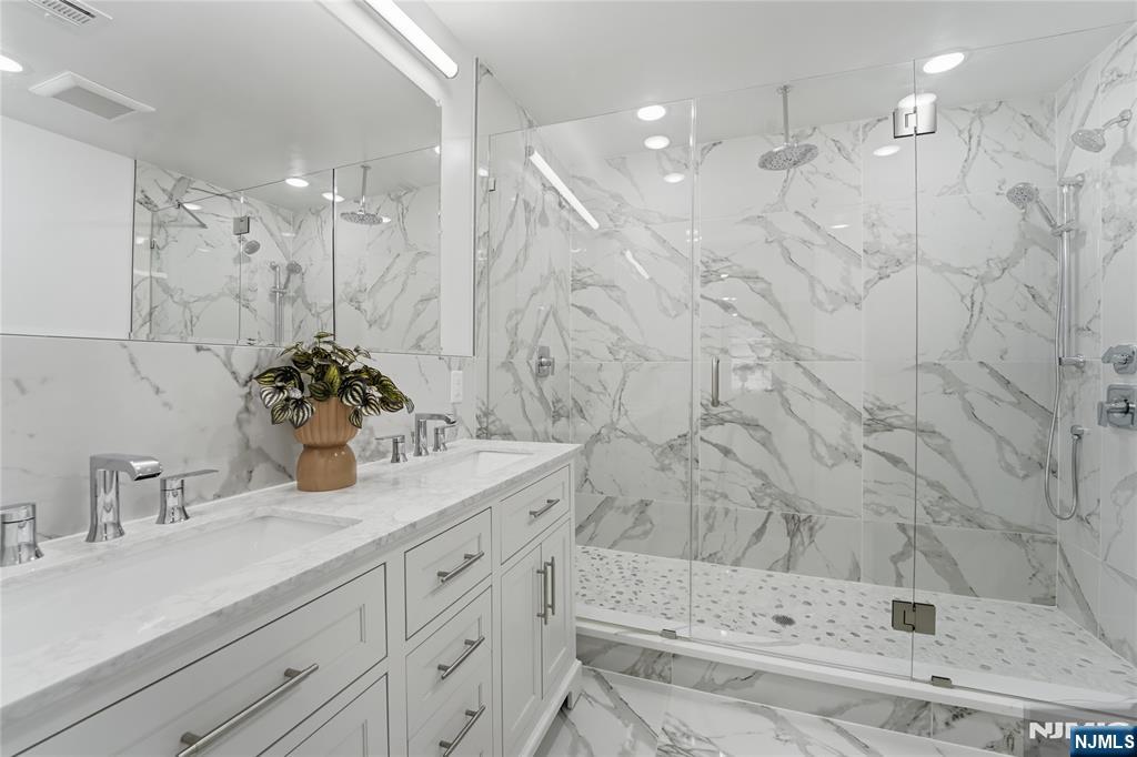 64 Morningside Road Verona, NJ 07044 - Photo 27 of 49 a bathroom with a sink vanity granite tub and shower