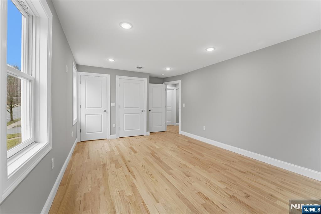 64 Morningside Road Verona, NJ 07044 - Photo 39 of 49 a view of empty room with wooden floor and fan