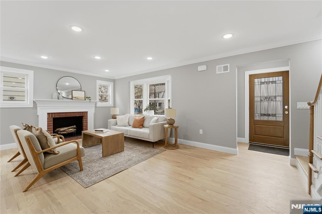 64 Morningside Road Verona, NJ 07044 - Photo 4 of 49 a living room with furniture and a fireplace