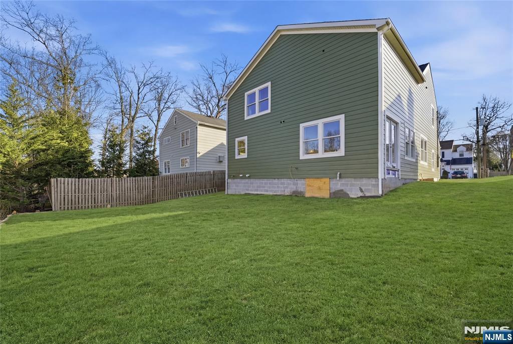 64 Morningside Road Verona, NJ 07044 - Photo 49 of 49 a front view of house with yard and trees in the background