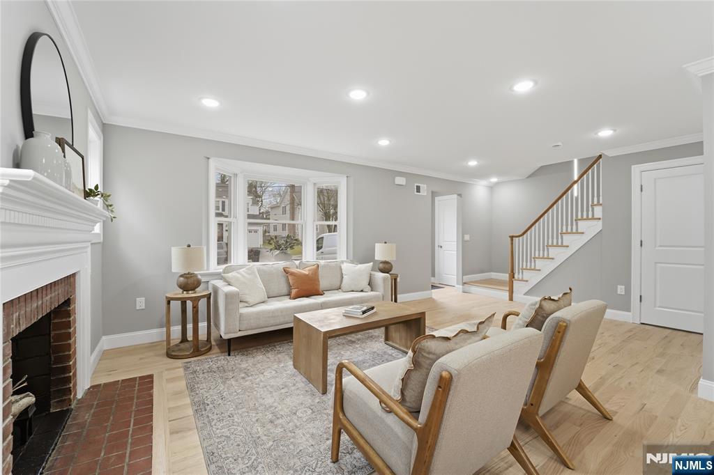 64 Morningside Road Verona, NJ 07044 - Photo 5 of 49 a living room with furniture and a fireplace