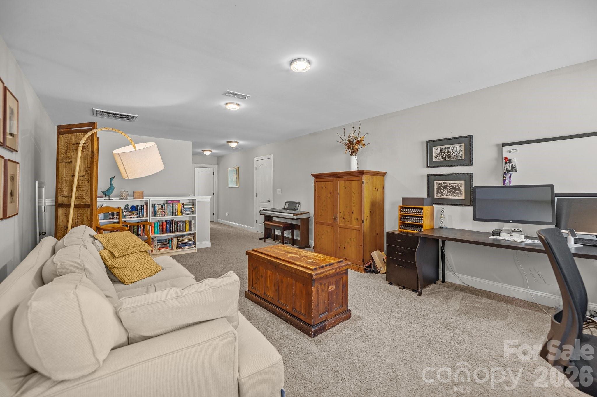 4697 Rinaldo Road York, SC 29745 - Photo 23 of 37 a living room with furniture and a flat screen tv