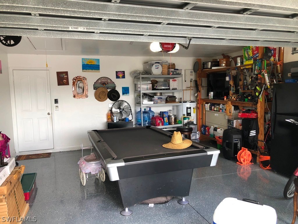 203 Roat Street Lehigh Acres, FL 33936 - Photo 14 of 15 a room with gym equipment