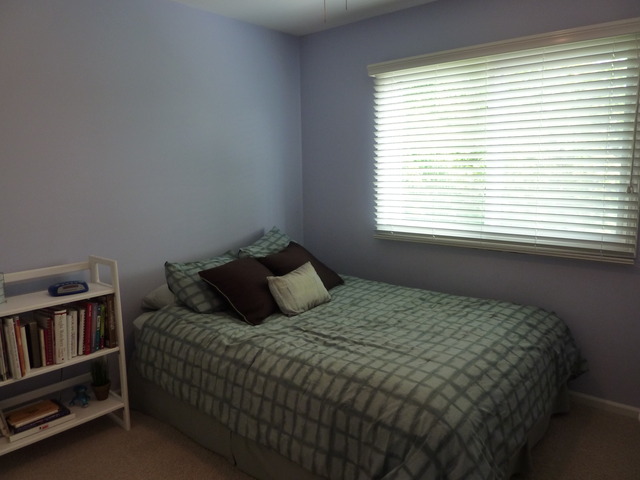 631 Raintree Road Buffalo Grove, IL 60089 - Photo 17 of 22 a bedroom with a bed furniture and a window