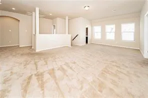 a view of empty room with a fireplace