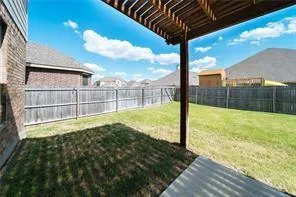 a view of a house with pool and a yard