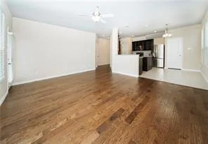 a view of a kitchen with a sink and a stove top oven