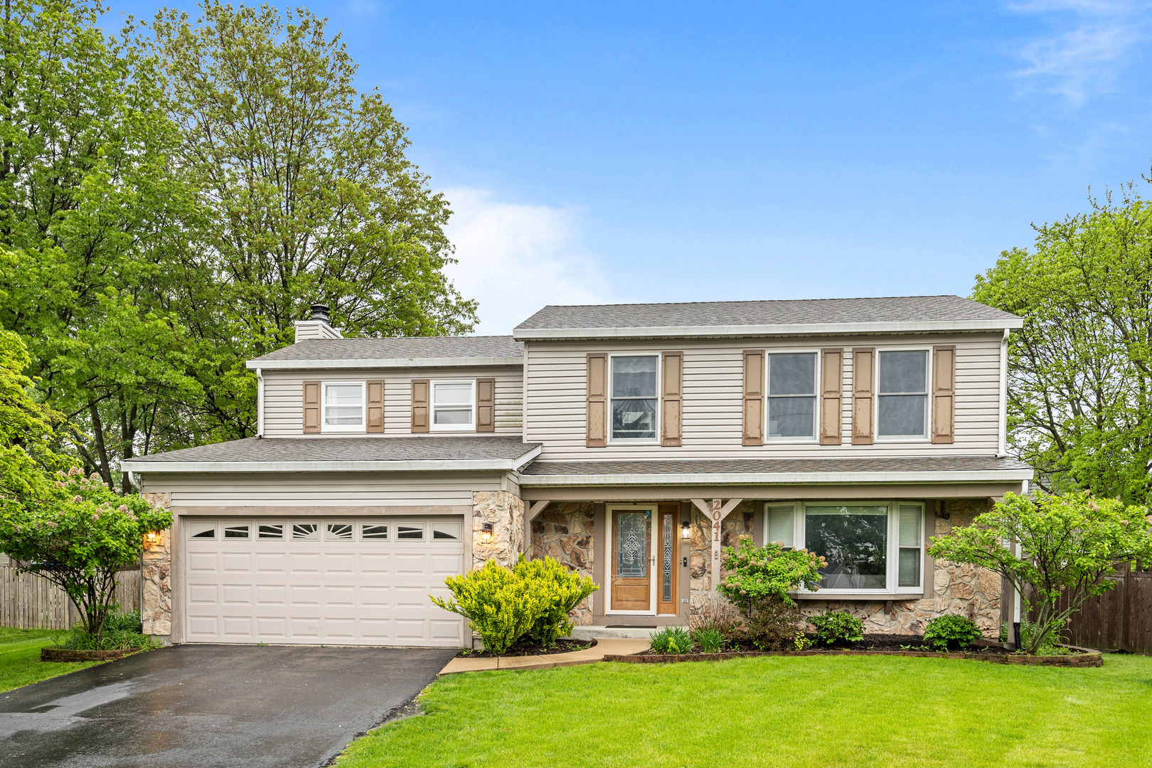 2041 Valley Road Lombard, IL 60148 - Photo 1 of 30 a front view of a house with a yard and garage