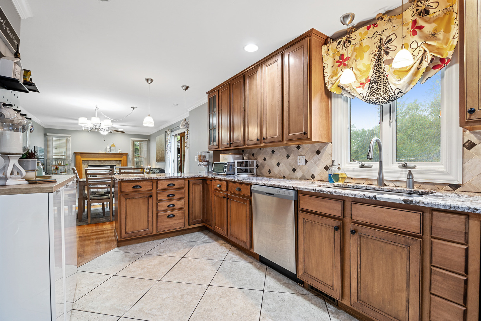 2041 Valley Road Lombard, IL 60148 - Photo 6 of 30 a kitchen with stainless steel appliances granite countertop a sink and cabinets