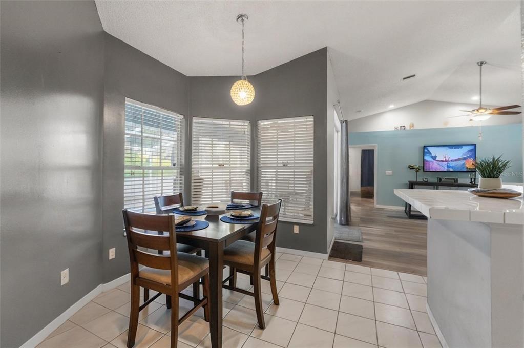 13377 Elise Lane Spring Hill, FL 34609 - Photo 13 of 30 a view of a dining room with furniture
