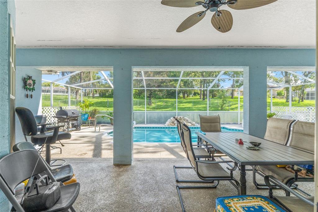 13377 Elise Lane Spring Hill, FL 34609 - Photo 18 of 30 a view of a dining room with furniture window and outside view