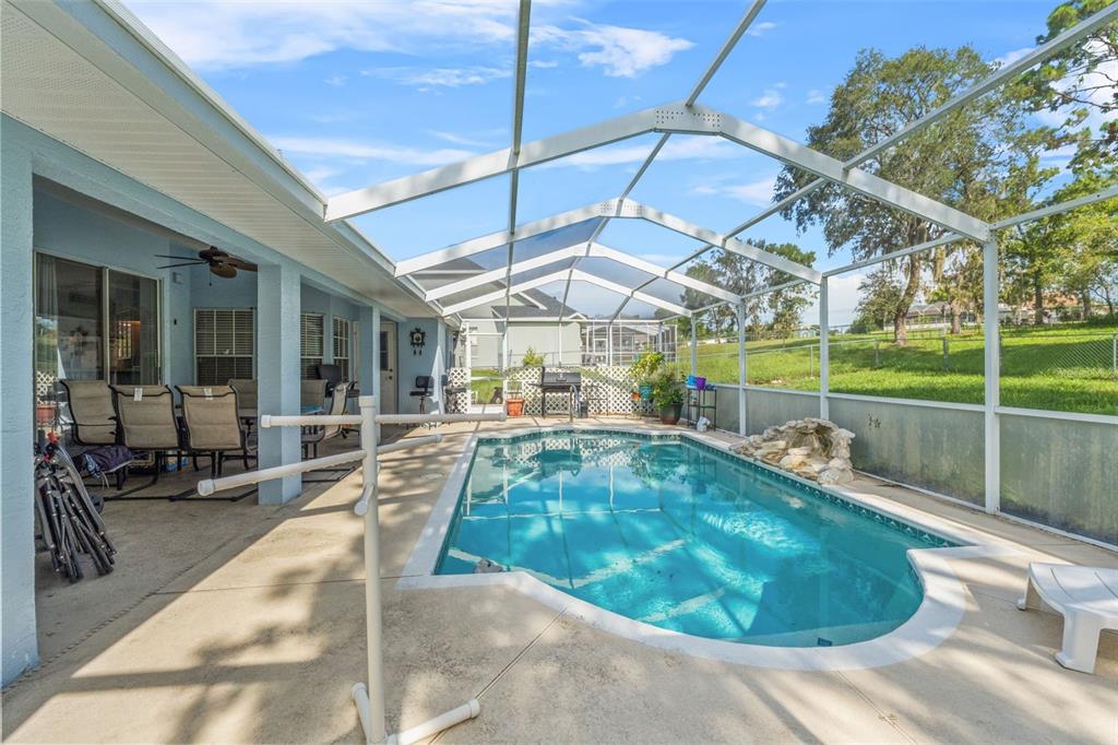 13377 Elise Lane Spring Hill, FL 34609 - Photo 19 of 30 a view of a swimming pool with a patio