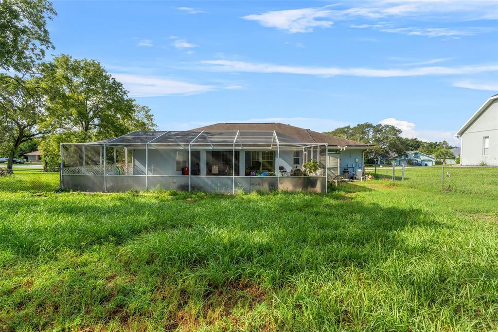 13377 Elise Lane Spring Hill, FL 34609 - Photo 24 of 30 a view of a house with a big yard