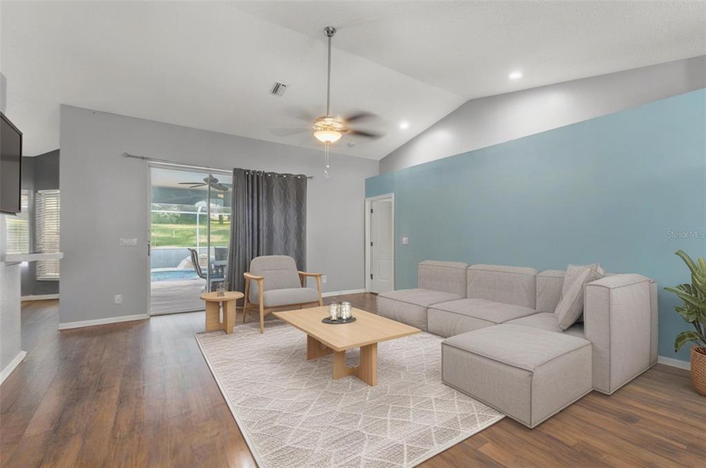 13377 Elise Lane Spring Hill, FL 34609 - Photo 5 of 30 a living room with furniture and wooden floor