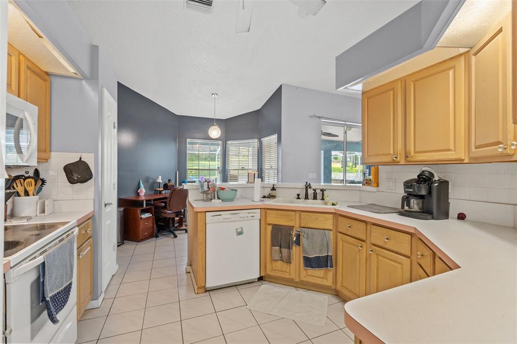 13377 Elise Lane Spring Hill, FL 34609 - Photo 10 of 30 a large kitchen with stainless steel appliances lots of counter top space cabinets and a sink