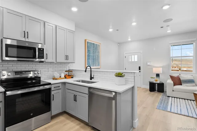 a kitchen with a sink and cabinets