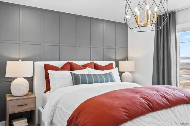 an aerial view of a house with a swimming pool and outdoor seating