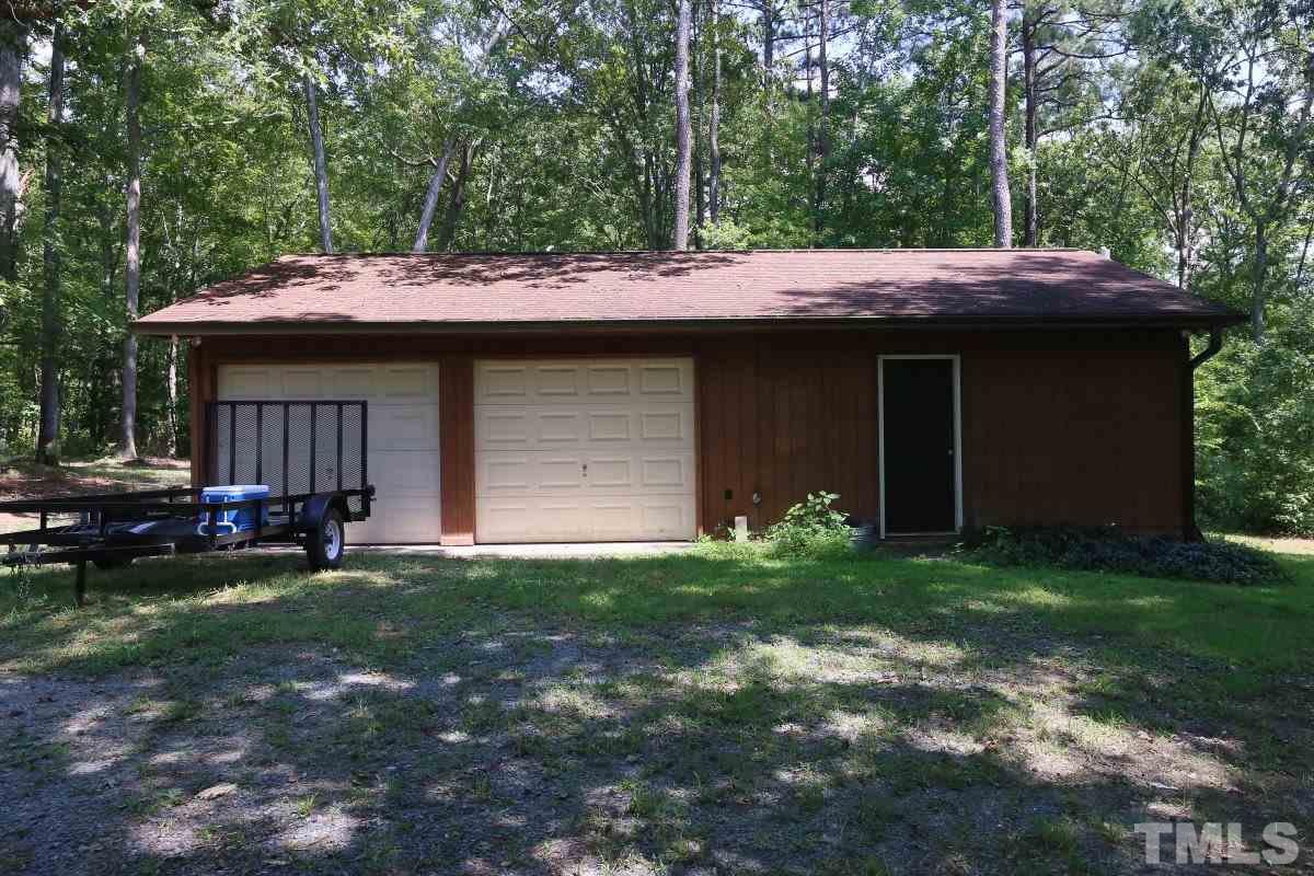 156 Rocky Road Apex, NC 27523 - Photo 22 of 25 Detached 2 car garage + big workshop + carport for boat storage!