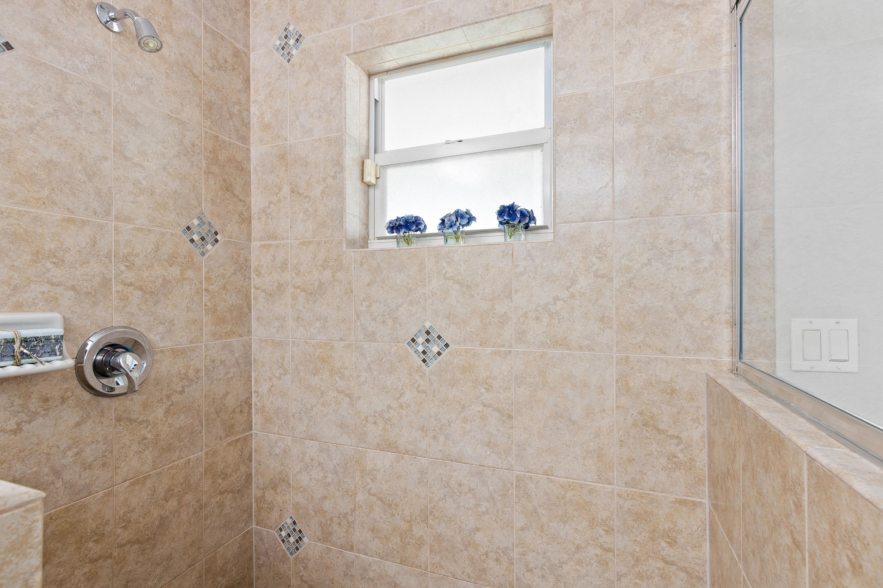 5317 Palm Ridge Boulevard Delray Beach, FL 33484 - Photo 24 of 39 a bathroom with a shower