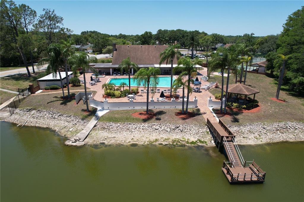 9319 Trowbridge Court New Port Richey, FL 34655 - Photo 72 of 78 a view of a lake with a house